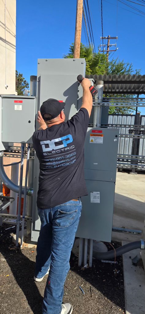 DCP Electric field technician installing commercial disconnect